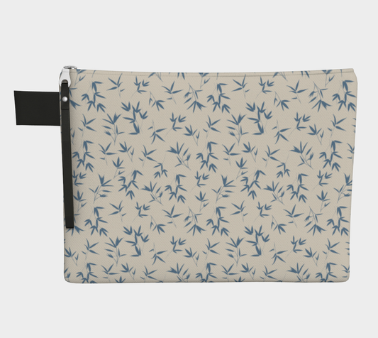 Small scale tossed repeat of bamboo leaves in denim blue on a bone background. Zipper carry pouch with vegan leather tab and pull.