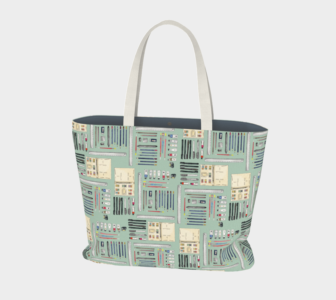 Art Supplies in a repeating pattern on a sage green background. Large market tote bag with white cotton canvas handles.