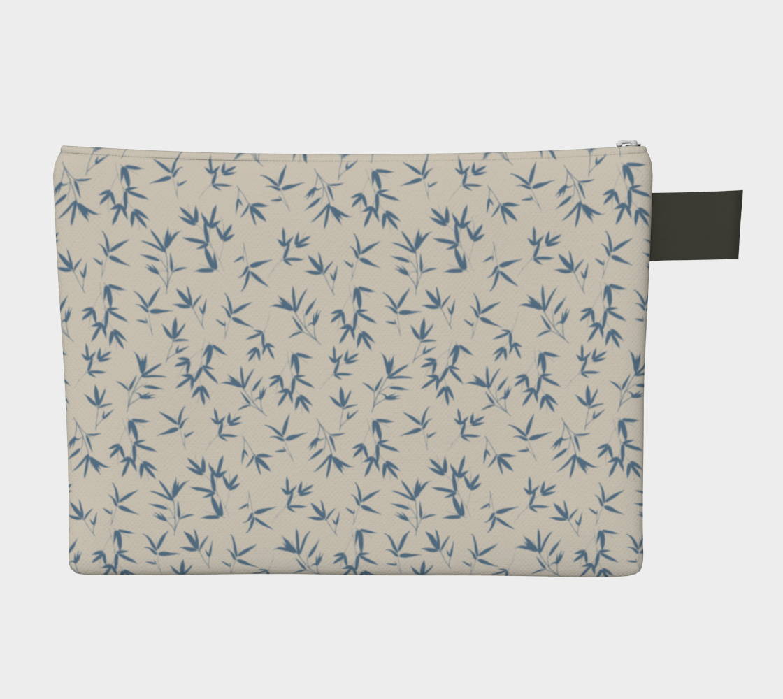 Small scale tossed repeat of bamboo leaves in denim blue on a bone background. Zipper carry pouch with vegan leather tab and pull.