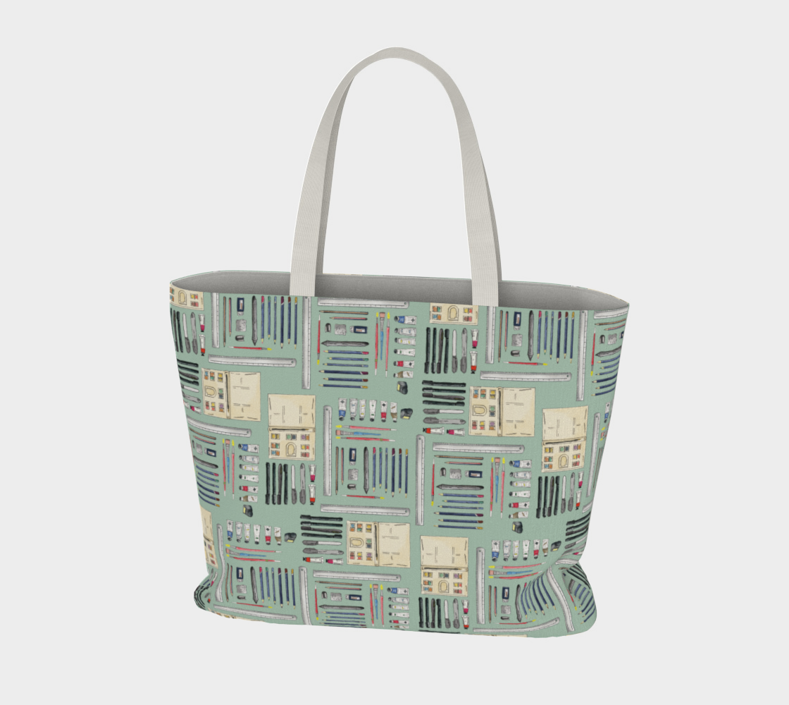 Art Supplies in a repeating pattern on a sage green background. Large market tote bag with white cotton canvas handles.