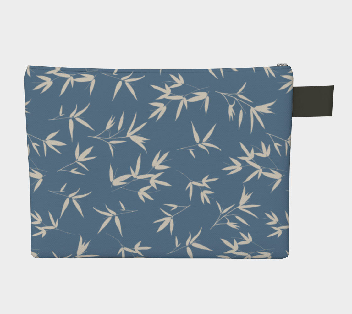 Zipper pouch. Bone bamboo leaves in a tossed repeat on a denim blue background.