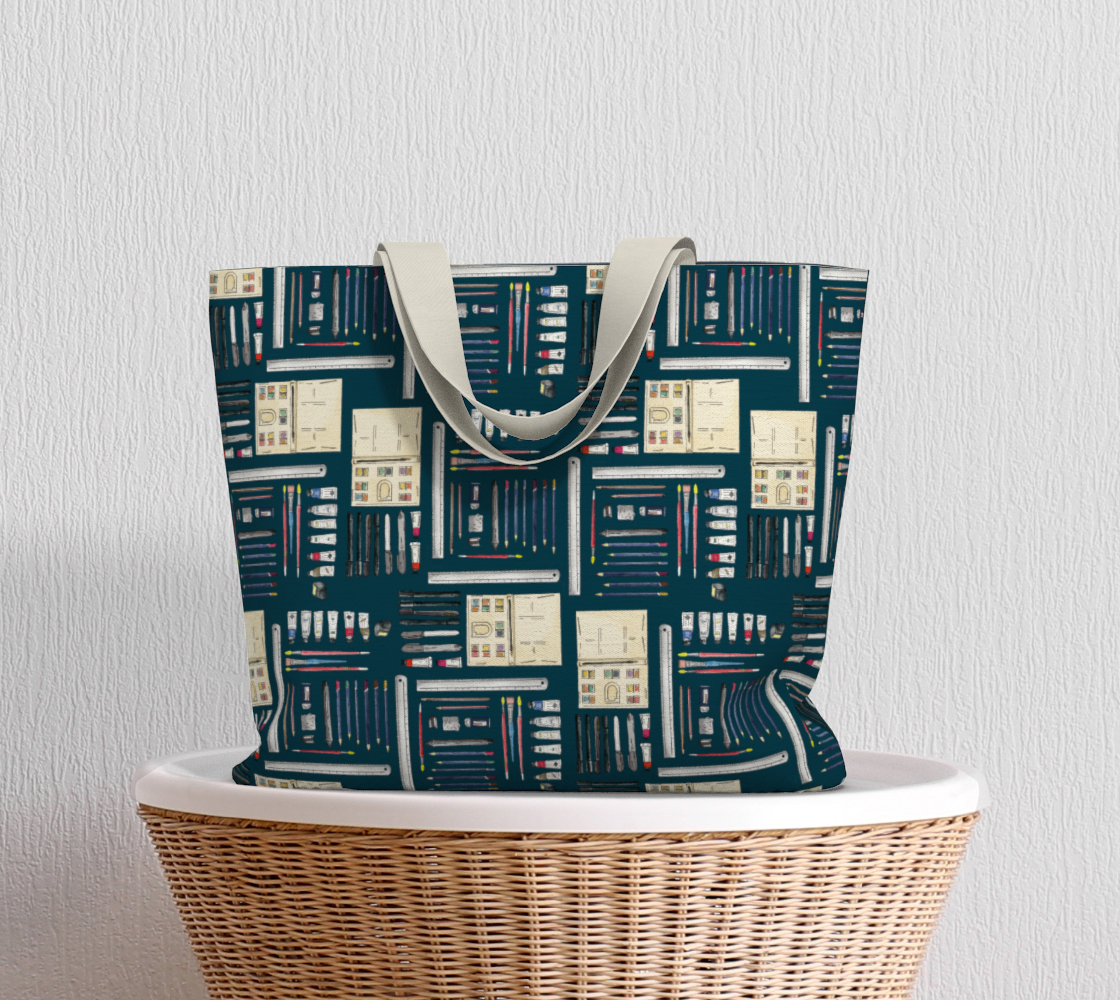 Art Supplies in a repeating pattern on a Dark Teal background. Large market tote bag with white cotton canvas handle. 