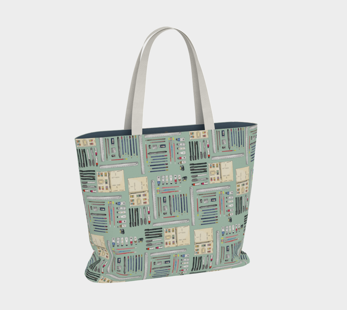 Art Supplies in a repeating pattern on a sage green background. Large market tote bag with white cotton canvas handles.