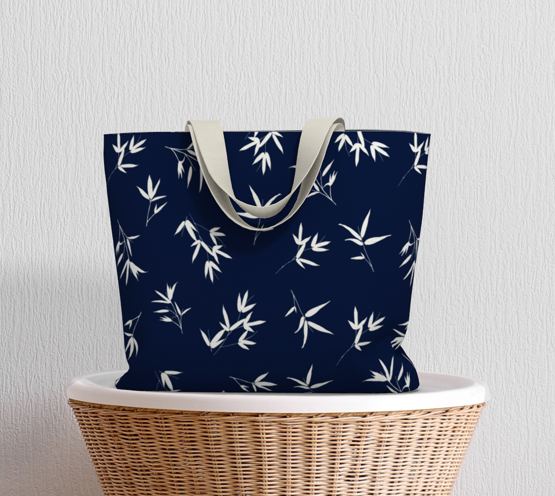 White bamboo leaves in a tossed repeat on a Navy background. Market Tote Bag