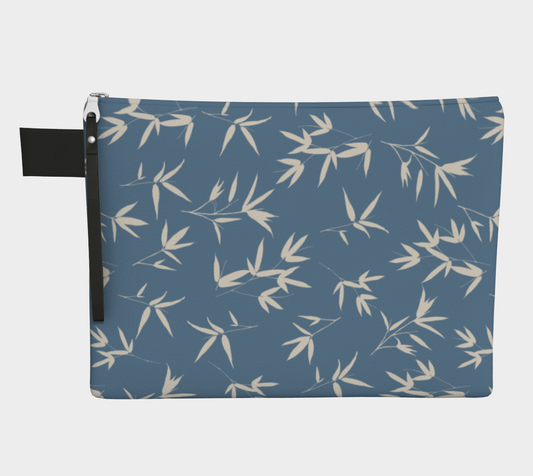 Zipper pouch. Bone bamboo leaves in a tossed repeat on a denim blue background. 